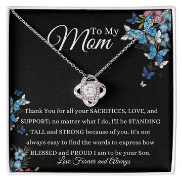 Necklace with a card for mom on a black background with butterflies and floral designs