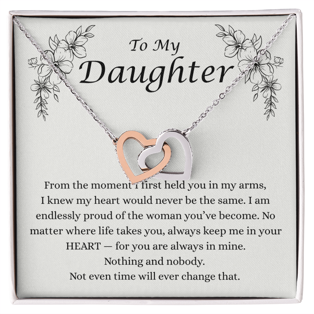 “To My Daughter” message card necklace with interlocking hearts, featuring a heartfelt note from mom expressing pride, love, and everlasting connection.